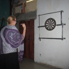 Hannah playing darts